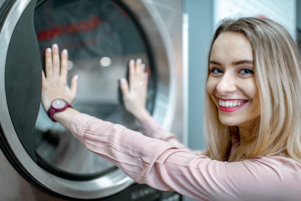 Happy woman in the laundry
